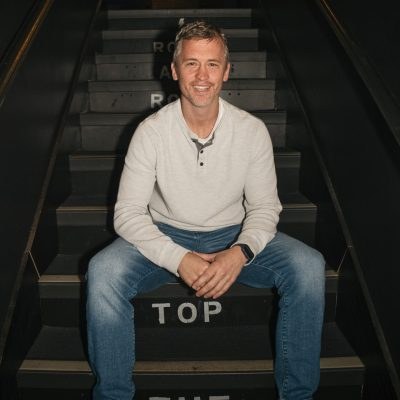 Matt McCusker seated on a stairway